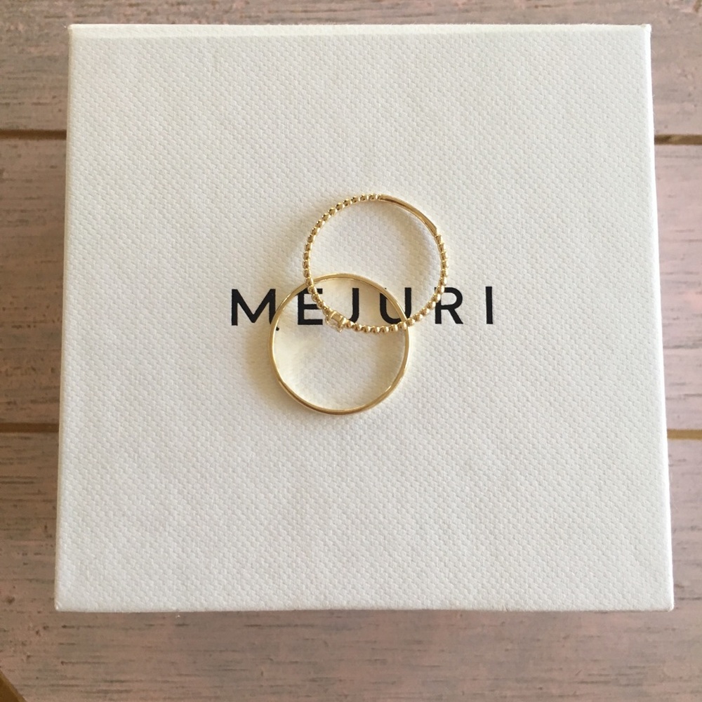 Mejuri solid 14k gold stacker rings with diamond.